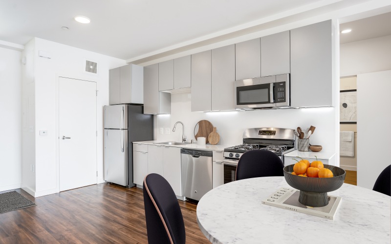 a kitchen with a table and chairs