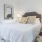 a bed with a white bed spread