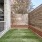 a dog run with a wooden fence